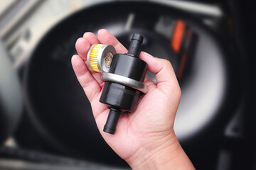 LPG gas filter set of car , CNG or NGV gas filter set in a hand , Automotive parts concept