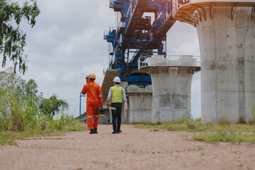 Surveying engineers take measurements with theodolite instruments at construction sites. Surveyors...