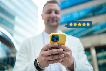 Customer satisfaction experience concept. Businessman using mobile phone giving 4 star icon and excellent for feedback review satisfaction service. rating very impressed. High quality photo