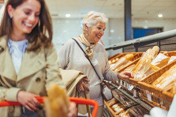 Smiling Women Shopping for Bread in a Supermarket