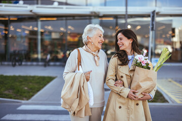 Smiling Women Enjoy a Sunny Day After Shopping