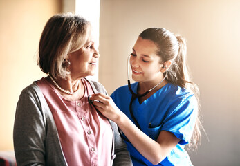 Senior woman, nurse and stethoscope for listening to heartbeat, check up or cardiology exam. Retirement, breath or doctor test lungs of happy patient for medical healthcare, help or diagnosis in home