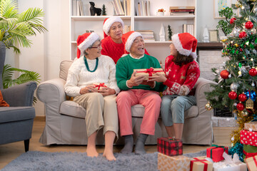 Family members are exchanging gifts with each other during the Christmas holiday at home