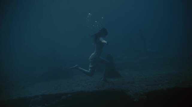 Underwater exploration in a serene blue ocean scene
