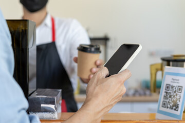 man use smartphone to scan QR code to pay in cafe restaurant with a digital payment without cash. Choose menu and order accumulate discount. E wallet, technology, pay online, credit card, bank app.