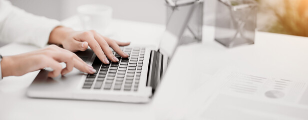 Job Search. Side view of unrecognizable girl using laptop, finding work projects online. Selective...
