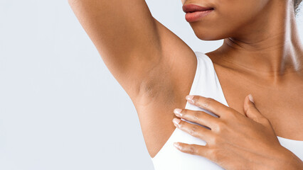 Cropped of black woman smelling her armpit, under arms hyperhidrosis, copy space