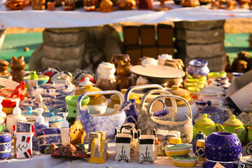 Traditional Indian handmade Items of Earthenware Or Ceramic at a Vendor Stall, decorative  Sculpture  Made with Earthen Mud, handcrafted traditional clay decoration toy in indian market
