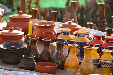 Traditional Indian handmade Items of Earthenware Or Ceramic at a Vendor Stall, decorative  Sculpture  Made with Earthen Mud, handcrafted traditional clay decoration toy in indian market
