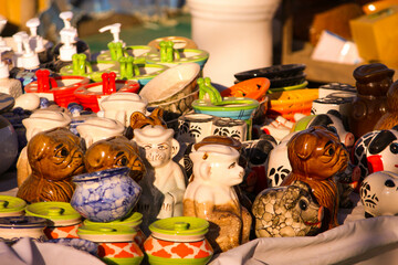 Traditional Indian handmade Items of Earthenware Or Ceramic at a Vendor Stall, decorative  Sculpture  Made with Earthen Mud, handcrafted traditional clay decoration toy in indian market
