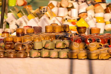 Traditional Indian handmade Items of Earthenware Or Ceramic at a Vendor Stall, decorative  Sculpture  Made with Earthen Mud, handcrafted traditional clay decoration toy in indian market
