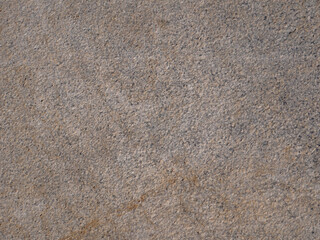 Dark aged shabby cliff face. Texture of mountains.
