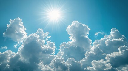 Fluffy white clouds scattered across a bright blue sky on a sunny day in mid-afternoon