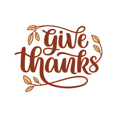Give thanks hand lettering composition with yellow leaves