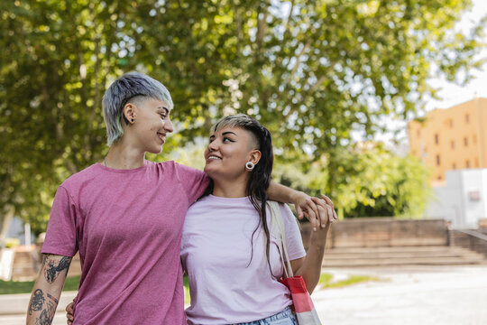 Affectionate lesbian couple enjoying a sunny day in the park