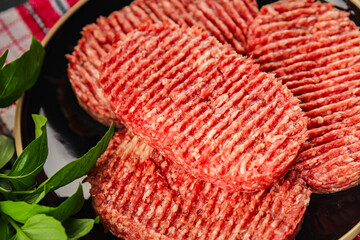 Raw cutlet fresh ground meat beef burger, pork, chicken, turkey second course dish fresh delicious gourmet food background on the table rustic food top view copy space