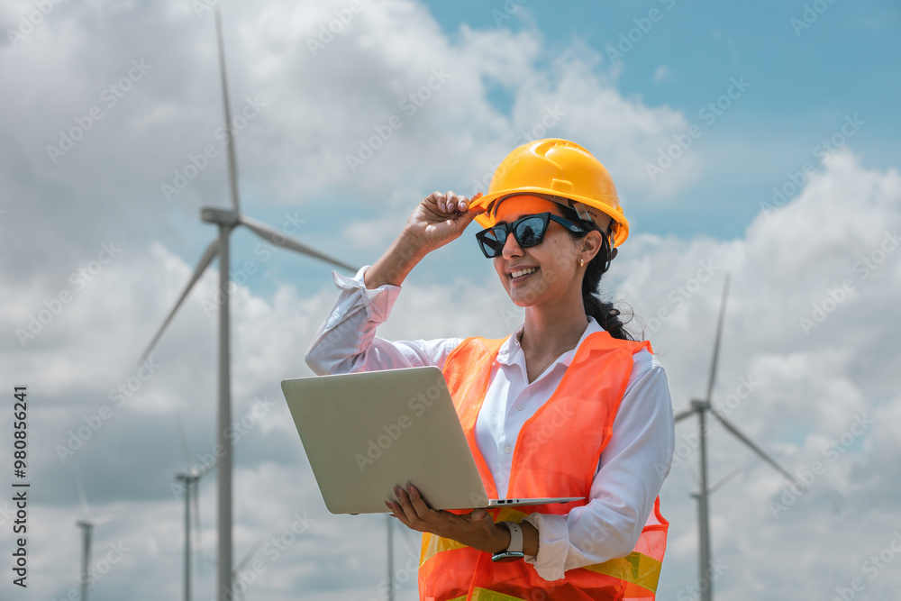 Poster renewable energy systems concept, engineer female using laptop working wind turbine for alternative 
