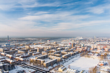 Fototapeta premium Aerial view of Klaipeda city port area and it's surroundings on sunny winter evening. The Old town of Klaipeda, Lithuania in evening light at wintertime.