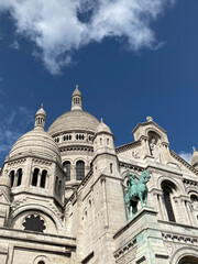 Fototapeta premium Majestic Cathedral with Statue Against Blue Sky
