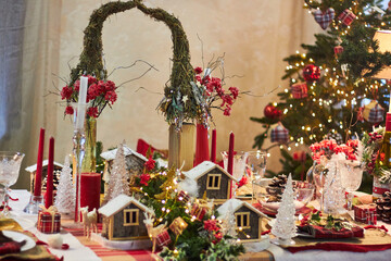 Christmas table setting indoors Christmas decoration in classic red and gold color scheme