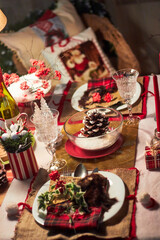 Christmas table setting indoors Christmas decoration in classic red and gold color scheme