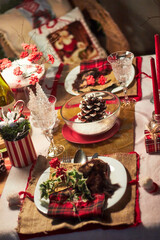 Christmas table setting indoors Christmas decoration in classic red and gold color scheme