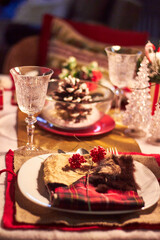 Christmas table setting indoors Christmas decoration in classic red and gold color scheme