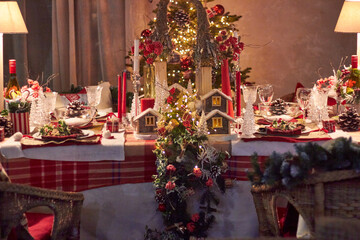 Christmas table setting indoors Christmas decoration in classic red and gold color scheme