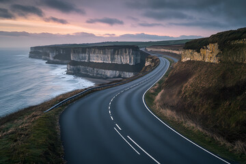 Winding Road Along Dramatic Coastal Cliffs at Sunset