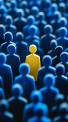 Obraz premium Lone yellow figurine stands out amidst a sea of identical blue figurines