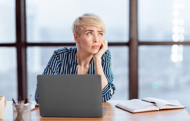 Boring Job. Unmotivated Unhappy Lady Sitting At Workplace In Modern Office. Copy Space, Selective...