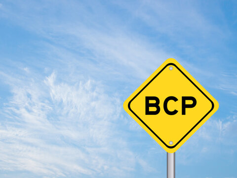 Yellow transportation sign with word BCP (abbreviation business continuity plan) on blue color sky background