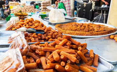 Balah el Sham or Tulumba authentic middle eastern dessert on market stalls at Bazar or market in...