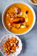Creamy baked pumpkin soup with pumpkin seeds and almonds .style hugge