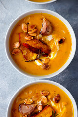 Creamy baked pumpkin soup with pumpkin seeds and almonds .style hugge
