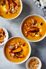 Creamy baked pumpkin soup with pumpkin seeds and almonds .style hugge