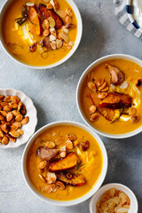Creamy baked pumpkin soup with pumpkin seeds and almonds .style hugge