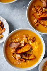 Creamy baked pumpkin soup with pumpkin seeds and almonds .style hugge
