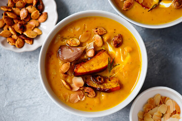 Creamy baked pumpkin soup with pumpkin seeds and almonds .style hugge