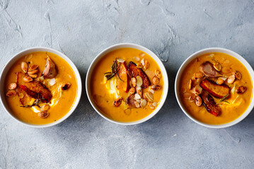 Creamy baked pumpkin soup with pumpkin seeds and almonds .style hugge