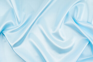 Smooth elegant blue silk or satin luxury cloth texture can use as ackground.