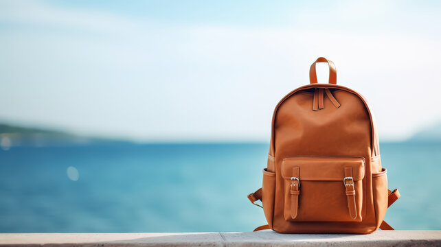 tourist backpack against blue sea ocean hon sand beach, blurred panoramic seascape blank, traveler relax holiday concept, sunlight view in trip vacation - Powered by Adobe