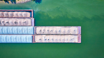 Aerial Top Down View of Barges with Sand on Green River