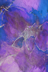 Vibrant abstract watercolor design featuring swirling shapes and colors in shades of purple, blue, and green on a textured background