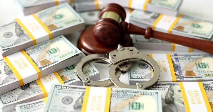 Judge gavel handcuffs and banknotes concept. Economic crime concept of collateral fraud and corruption