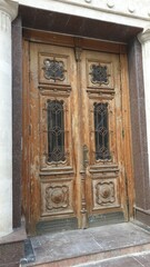 Moldova, Chisinau, capital, rain, puddle, gate, street, monument, building, architecture, antiquity, door, restoration, trees, leaves, autumn, flowerbed, flowers, berries, porch, steps, columns