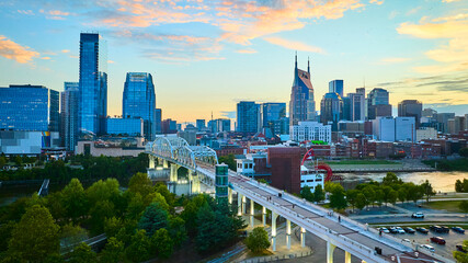 Aerial View of Nashville Skyline with Sunset Over Pedestrian Bridge