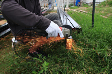 Workers are using steel cutting tools