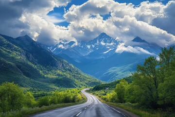 Naklejka premium Old Highway Through Mountainous Terrain Under a Cloudy Sky on a Summer Day