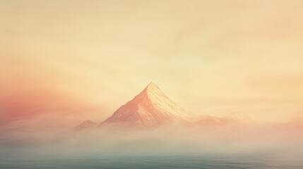 Mountain peak emerging from misty haze at